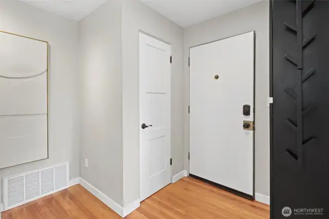 So much great storage in this unit! Coat closet + addition built-in storage on the right.