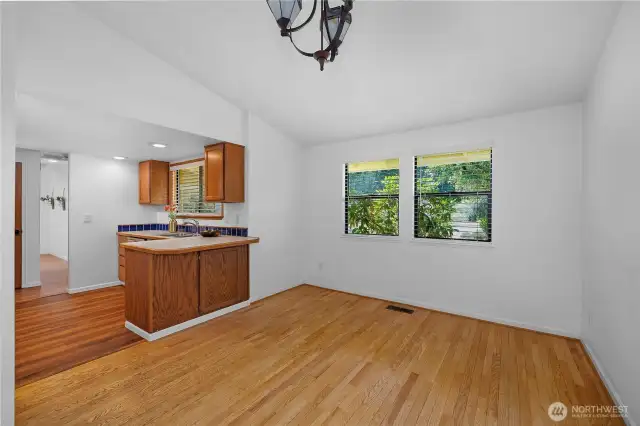 The dining room has hardwood maple flooring.  Your dining table will fit and is ready for entertaining and many meals to come.