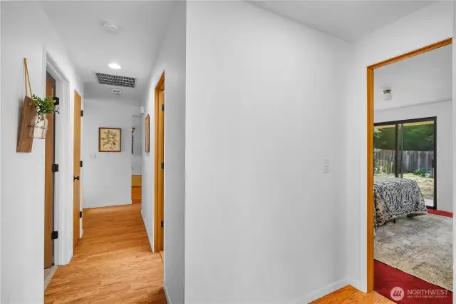 Hallway Looking to the foyer ahead and the primary bedroom to the right.