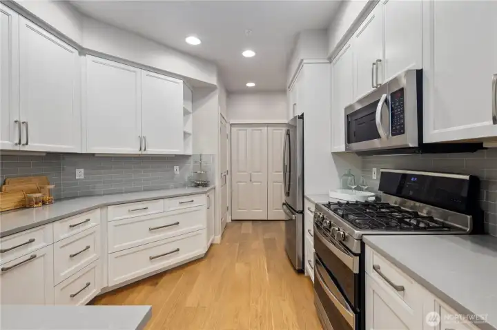 You'll never run out of storage with all these cabinets as well as a large pantry.