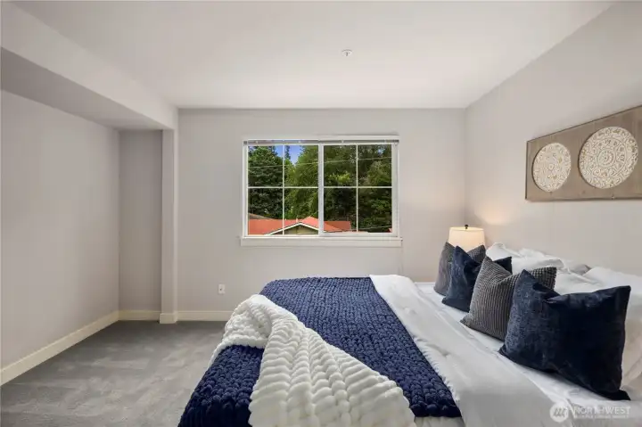 Upstairs, find bedroom #2 with newer carpet.