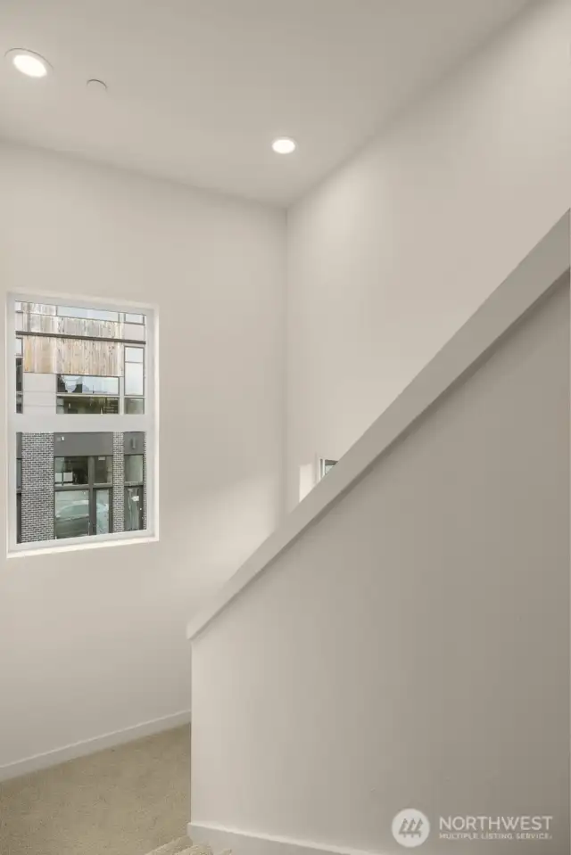 Staircase up to primary suite.