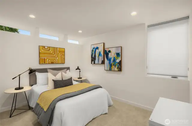 Lower level features a flex space and bedroom with a full bath.
