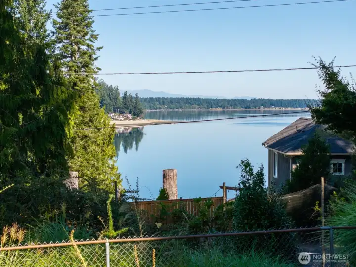 Longing for a charming, mid-century, one-story with a bit of Eld Inlet View, a 2 car shop, lower 1 car garage, a double lot with level RV parking all in Olympia Schools, and close to shopping, waterfront parks, more? Look here!