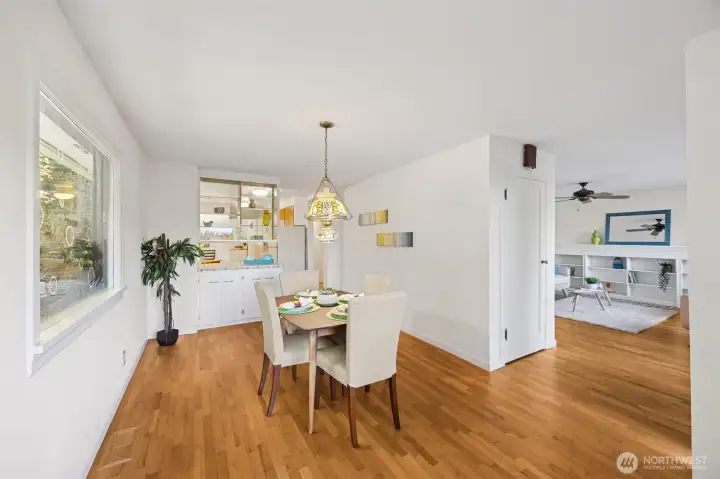 The floor plan allows easy entertaining but conceals the cook's creative mess with the pass-through counter and upper glass display cabinet between the dining and kitchen area.