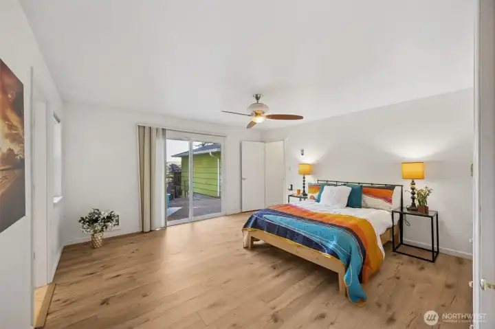 A corner view of the primary suite reveals space for a reading nook, and the courtyard access.