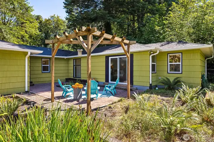 The courtyard area with patterned pavers and raised garden beds, waits for your green thumb, or gardener!  Place summer outdoor curtains on the arbor or grow climbers. Perfect for entertaining or private retreat.