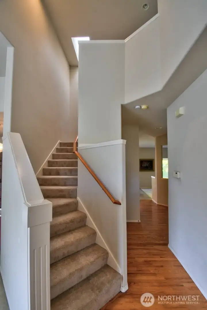 Stairs up to landing and four bedrooms