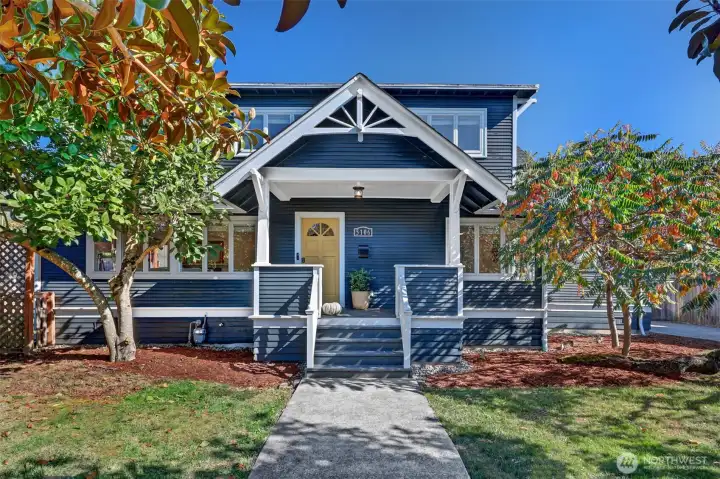 It's tucked behind the Magnolia trees with a covered porch to welcome you home.