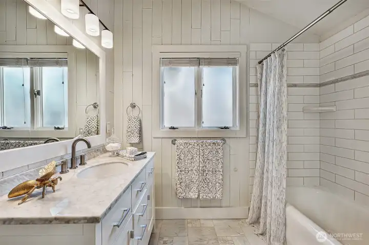 This full bathroom can accommodate the primary suite as well as a guest bathroom on the main floor.