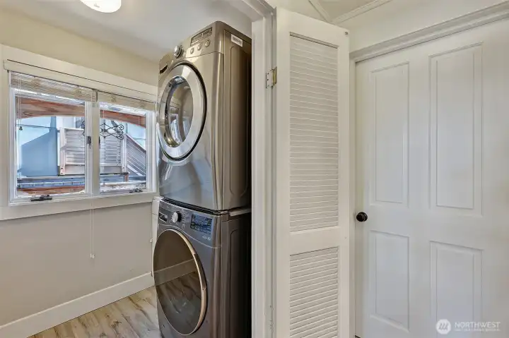 Main floor laundry room with utility sink.