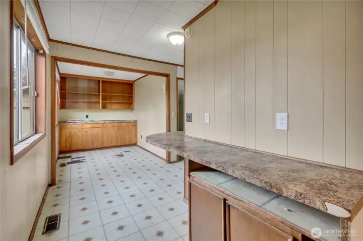 Off the kitchen is a dining area with a built-in buffet for convenient everyday storage.