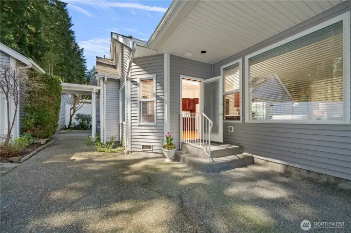 The covered breezeway on the left leads to the oversized two-car garage.