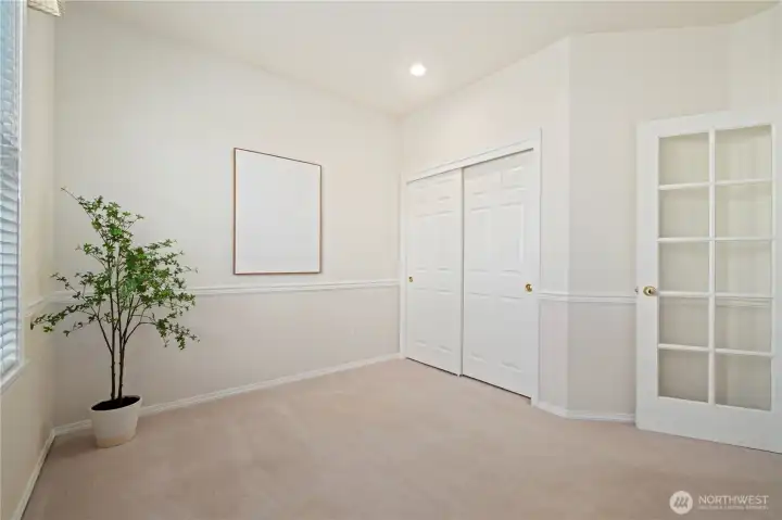 This spacious den/office is a serene place to work or relax and could easily function as a third bedroom with its closet.