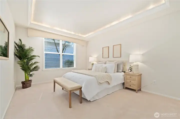 The primary suite is a   peaceful retreat at the end of the day.