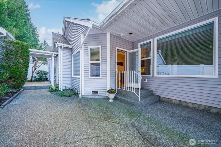The covered breezeway on the left leads to the oversized two-car garage.