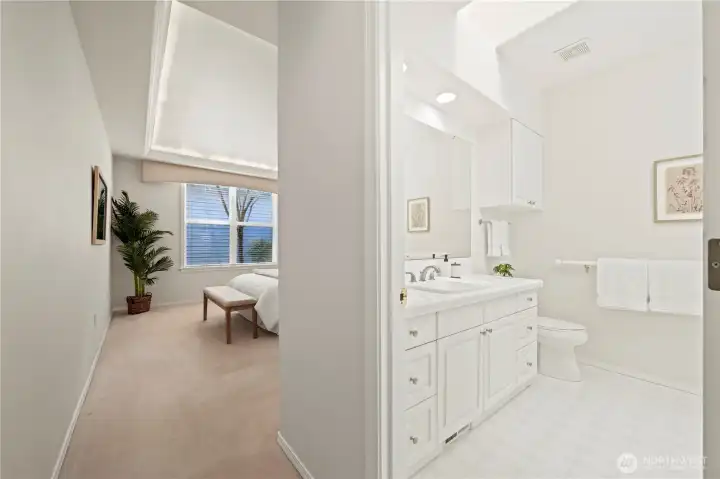 The en suite bath features a five-piece layout   with a jetted tub, walk-in shower, and   skylight