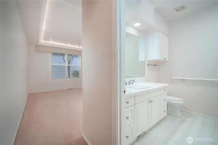 The en suite bath features a five-piece layout with a jetted tub, walk-in shower, and skylight.