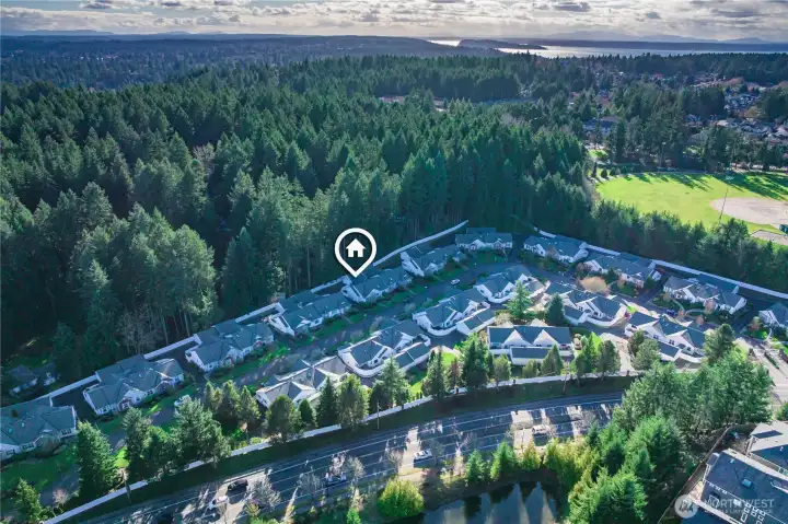 Tucked along a greenbelt, the setting offers   privacy and minimal road noise.