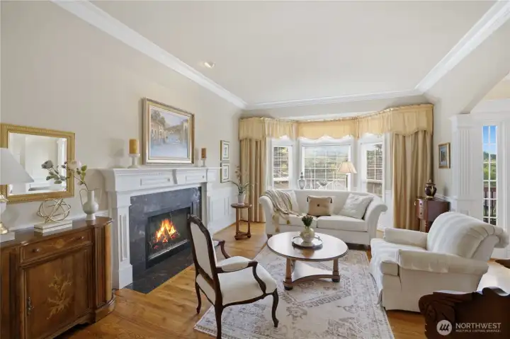 Formal living room with bay window & gas fireplace