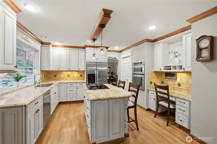Kitchen with spacious island & garden window has quality finishes