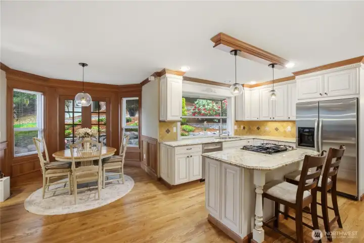 Breakfast nook has French door leading to entertainment size deck and backyard
