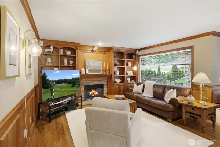 Family room is adjacent to the kitchen and has built-in bookcases