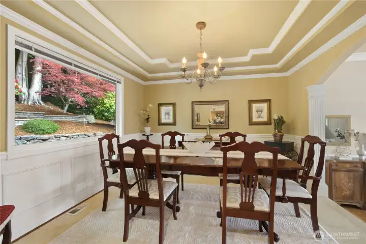 Formal dining room has tiled floor & picture window overlooking picturesque yard