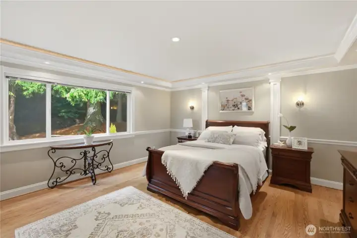 Large primary suite has hardwood floor and beautiful finishes