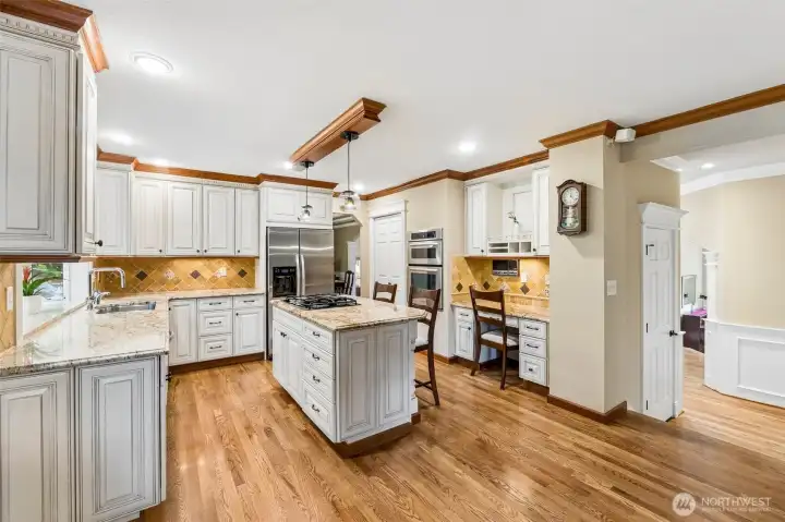 Kitchen has plenty of beautiful cabinets and pantry too.