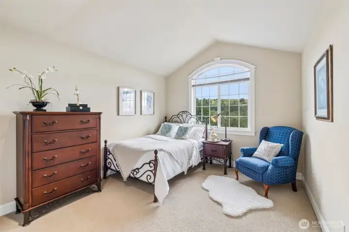 Bedroom with vaulted ceiling has a nice view
