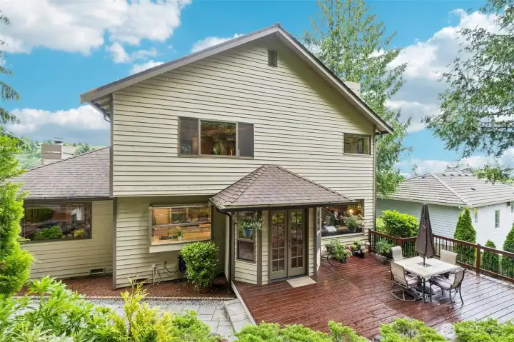 Back of the house with entertainment deck