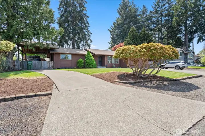Secondary driveway that leads to the covered RV area.