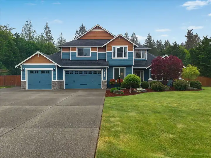 This home makes a statement. Stunning curb appeal, a spacious driveway with RV parking, and beautifully maintained landscaping set the tone for everything this property has to offer.
