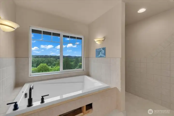 Top floor Primary bathroom features a large soaking tub
