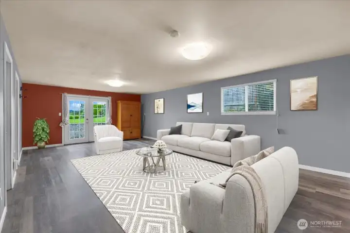 Lower level Family room ( Virtually Staged ) with exit to backyard