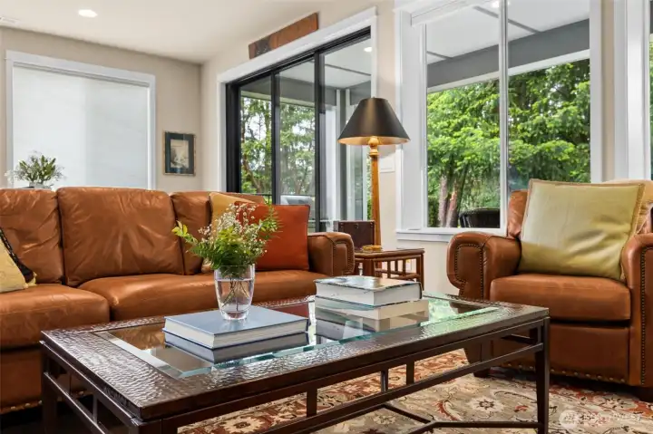 Living area leads to spacious covered deck through collapsable 3 panel door.