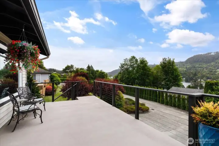 Out on the deck, you'll appreciate water-proof decking, modern railing and a covered dining area.
