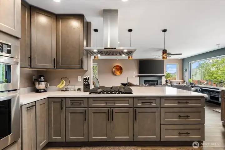 The open concept of the kitchen provides plenty of space for multiple cooks and helpers alike!