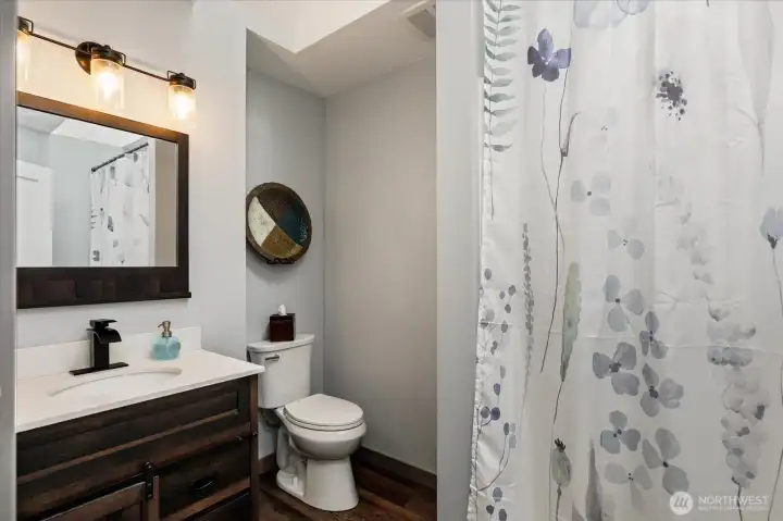 Just off the entry, a full bath is perfectly positioned.
