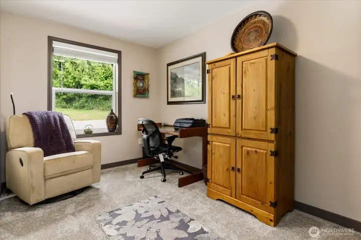 This first bedroom to the left of the entry has pretty garden views.