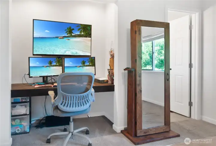 Just inside the primary bedroom is a home office space that could be transformed into another closet, and the doorway to the private full bath. Just inside the primary bedroom is a home office space that could be transformed into another closet, and the doorway to the private full bath.