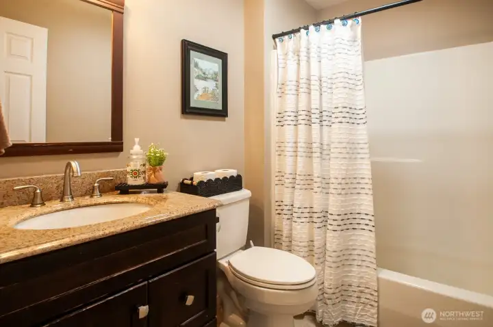 Off the same hallway is another full bath. Off the same hallway is another full bath.