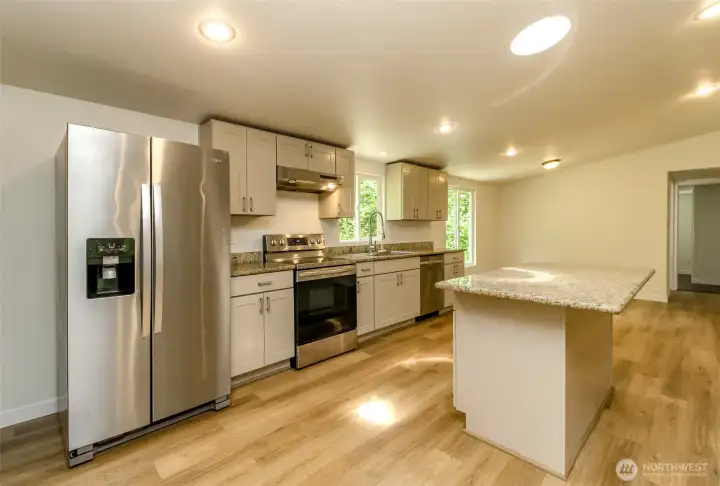 Refreshed kitchen cabinets, granite countertops