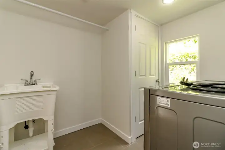 Laundry has utility sink.  Washer and dryer stay.