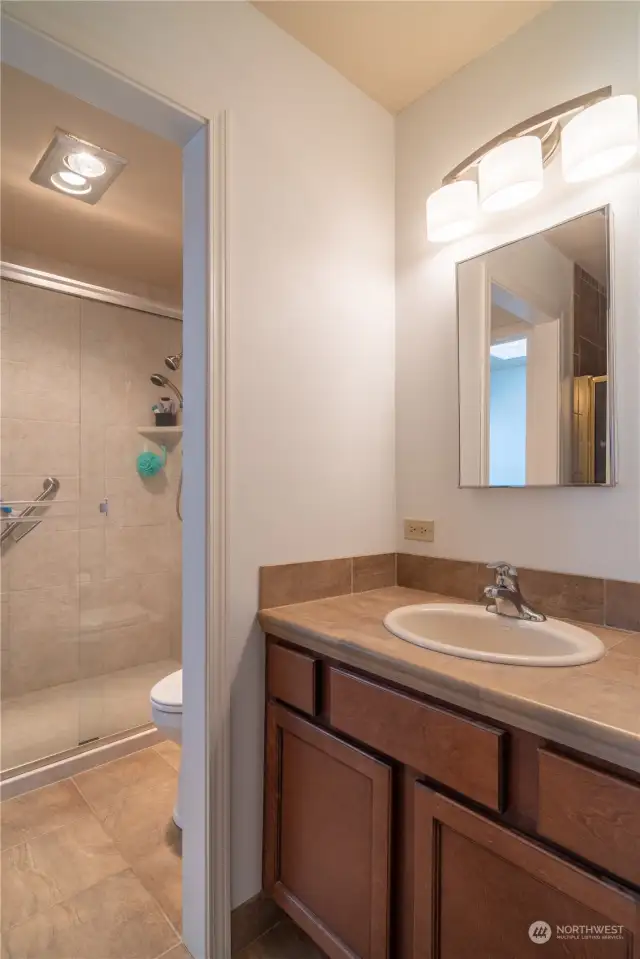 Upstairs bathroom with walk in shower.