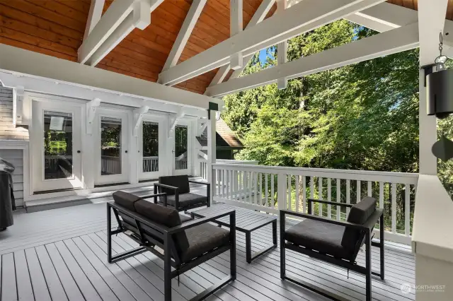 The covered back deck overlooking the beautiful backyard.