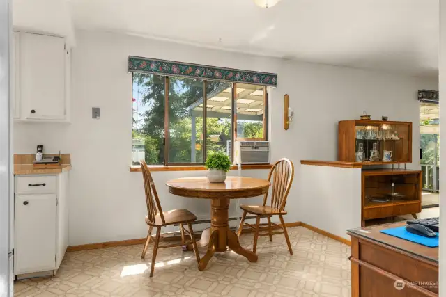 Kitchen eating space with room for you hutch or side board serving bar.