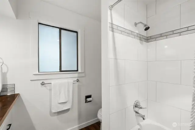 The tub/shower combination allows for either a quick shower or long soak in a bubblebath for a more luxurious experience.
