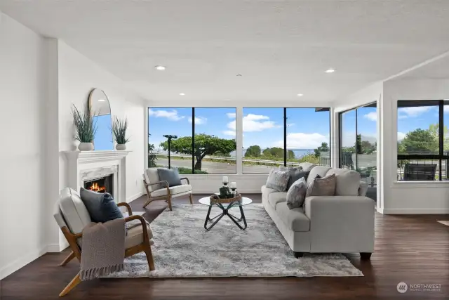 Water views provide a sense of calmness in a fast paced world. The living room includes a wall of windows for an incredible glimpse of the outdoors.